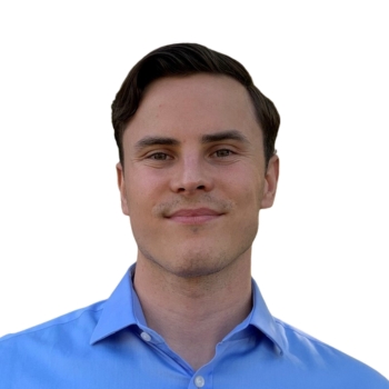 Man wearing collared blue business shirt.