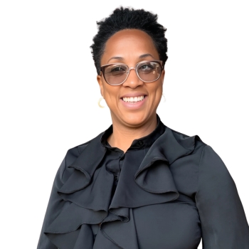 African American woman smiling wearing black blouse.